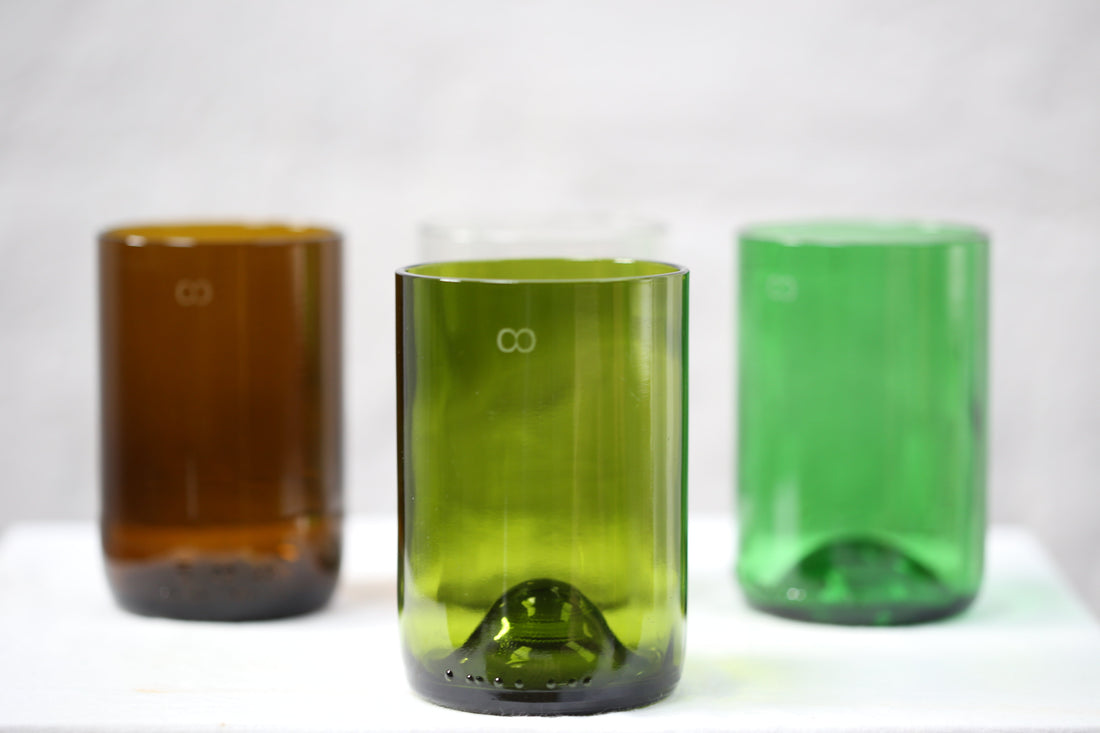 Photo of three glasses, made from reused wine bottles